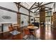 Clubhouse interior with exposed beams, wood floors, comfortable seating, and stone accents at 1233 Ashford Creek Ne Park, Atlanta, GA 30319