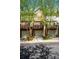Townhome exteriors with multi-car garages, balconies, brick accents, and mature trees at 1233 Ashford Creek Ne Park, Atlanta, GA 30319