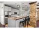 Modern kitchen featuring granite countertops, stainless steel appliances, and stylish pendant lighting at 1233 Ashford Creek Ne Park, Atlanta, GA 30319