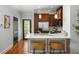 Modern kitchen with stainless steel appliances, quartz countertops, and a cozy breakfast bar at 1233 Ashford Creek Ne Park, Atlanta, GA 30319