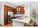 Well-lit kitchen with stainless steel appliances, ample cabinetry, and a breakfast bar with seating at 1233 Ashford Creek Ne Park, Atlanta, GA 30319