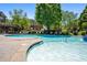 Community pool area with lounge chairs, mature trees, and well maintained landscaping at 1233 Ashford Creek Ne Park, Atlanta, GA 30319