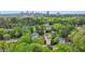 Aerial view of a residential neighborhood with mature trees and a cityscape in the background at 1282 Fairhill Ne Ln, Atlanta, GA 30319
