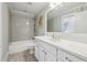 A newly renovated bathroom has white cabinets, stone floors, and updated fixtures at 1282 Fairhill Ne Ln, Atlanta, GA 30319