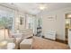 Bright Bedroom space with a plush chair, a storage chest, and a dresser under the window at 1282 Fairhill Ne Ln, Atlanta, GA 30319