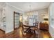 Charming dining room with hardwood floors, and a sliding barn door leading to an office space at 1282 Fairhill Ne Ln, Atlanta, GA 30319