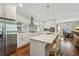 Open concept kitchen features stainless steel appliances, and breakfast bar, blending seamlessly with the dining and living areas at 1282 Fairhill Ne Ln, Atlanta, GA 30319