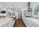 Modern kitchen features a spacious layout, stainless steel appliances, and stylish pendant lighting at 1282 Fairhill Ne Ln, Atlanta, GA 30319