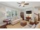 Inviting living room with hardwood floors, natural light, and a ceiling fan to ensure year round comfort at 1282 Fairhill Ne Ln, Atlanta, GA 30319