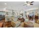 Bright open-concept space showcasing a combined living room, dining area, and a kitchen with stainless steel appliances at 1282 Fairhill Ne Ln, Atlanta, GA 30319