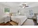 A light-filled main bedroom offers a ceiling fan and neutral decor at 1282 Fairhill Ne Ln, Atlanta, GA 30319