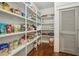 Walk-in pantry features plentiful shelving for dry-goods and kitchen essentials at 1282 Fairhill Ne Ln, Atlanta, GA 30319