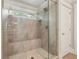 A glass enclosed shower is tiled and includes a seat at 1282 Fairhill Ne Ln, Atlanta, GA 30319