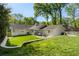 Well-maintained backyard with lush lawn, patio, and mature trees provides a serene outdoor living space at 1305 Old Woodbine Rd, Atlanta, GA 30319