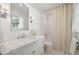 Elegant bathroom featuring a marble countertop, vanity, and separate shower with curtain at 1305 Old Woodbine Rd, Atlanta, GA 30319