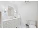 Bright bathroom featuring a vanity with marble countertop, and classic fixtures at 1305 Old Woodbine Rd, Atlanta, GA 30319
