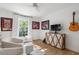 Inviting bedroom boasts hardwood floors, warm decor, and an abundance of natural light, creating a relaxing atmosphere at 1305 Old Woodbine Rd, Atlanta, GA 30319