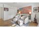 Cozy bedroom showcases beautiful decorations, including an American flag wall, hardwood floors, and ample space for relaxation at 1305 Old Woodbine Rd, Atlanta, GA 30319
