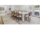 Dining room featuring a long table, chairs, and access to the backyard at 1305 Old Woodbine Rd, Atlanta, GA 30319