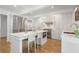 Open kitchen with stainless steel appliances, large island with seating, and ample cabinet space at 1305 Old Woodbine Rd, Atlanta, GA 30319