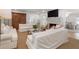 Bright living room with fireplace, white sofas and ample natural light at 1305 Old Woodbine Rd, Atlanta, GA 30319