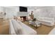Spacious living room with a fireplace and elegant white sofas at 1305 Old Woodbine Rd, Atlanta, GA 30319