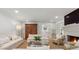 Cozy living room with a fireplace and comfortable white sofas at 1305 Old Woodbine Rd, Atlanta, GA 30319