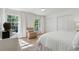 Bright main bedroom with white walls, neutral decor, and ample natural light from the large windows at 1305 Old Woodbine Rd, Atlanta, GA 30319
