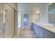 This bathroom features a double vanity, walk-in shower, and soaking tub at 2366 Cadenza Cir, Dacula, GA 30019