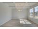 Airy dining room boasting light wood floors, decorative molding, and abundant natural light at 2366 Cadenza Cir, Dacula, GA 30019