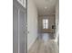 Bright entryway featuring luxury vinyl plank flooring and a modern gray front door at 2366 Cadenza Cir, Dacula, GA 30019