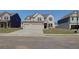 Charming two-story home with a two car garage and a well-manicured lawn at 2366 Cadenza Cir, Dacula, GA 30019