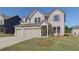 Inviting two-story brick home with a well-kept lawn and attached two-car garage at 2366 Cadenza Cir, Dacula, GA 30019