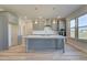 Kitchen with modern grey cabinets, white countertops, stainless steel appliances, and a center island at 2366 Cadenza Cir, Dacula, GA 30019