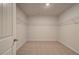 Large, carpeted walk-in closet with white walls and wire shelving at 2366 Cadenza Cir, Dacula, GA 30019