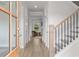 Inviting entryway with hardwood floors, white walls, staircase and an open view to the living room at 4038 Andover Cir, Mcdonough, GA 30252