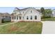 Beautiful home with a long driveway and a well-manicured front lawn at 4038 Andover Cir, Mcdonough, GA 30252