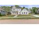 Charming two-story home with a landscaped front yard, inviting porch, and classic architectural details at 4038 Andover Cir, Mcdonough, GA 30252