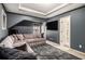 Finished basement featuring a sectional sofa, plush rug, and entertainment center at 4435 Bellwood Cir, Atlanta, GA 30349