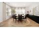 Bright dining room featuring modern black chairs and hardwood flooring at 4435 Bellwood Cir, Atlanta, GA 30349