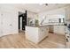 Open kitchen with a center island, stainless appliances, and hardwood floors at 4435 Bellwood Cir, Atlanta, GA 30349