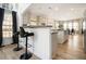 Bright kitchen area with a center island, hardwood floors, and breakfast bar at 4435 Bellwood Cir, Atlanta, GA 30349