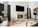 Bright living room with fireplace, wood floors and bar seating at 4435 Bellwood Cir, Atlanta, GA 30349
