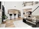 Open-concept living room with bar seating and view of staircase to upper level at 4435 Bellwood Cir, Atlanta, GA 30349