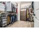 Organized walk-in closet with shelves, rods, dresser, carpet flooring, and plenty of storage space at 4435 Bellwood Cir, Atlanta, GA 30349