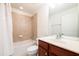 Bathroom featuring a tile surround shower, a cherry wood vanity, and modern fixtures at 2145 Shoop Se Ct # 3, Smyrna, GA 30080