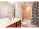 Bright bathroom with a dark wood vanity, mirror, and a tiled shower with a tub at 2145 Shoop Se Ct # 3, Smyrna, GA 30080