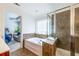 Bathroom featuring a soaking tub, separate shower, and view to the bedroom at 2145 Shoop Se Ct # 3, Smyrna, GA 30080