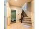Inviting entryway with tile flooring, carpeted stairs, and a view into the garage at 2145 Shoop Se Ct # 3, Smyrna, GA 30080