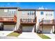 Back exterior view of townhomes showing patios and attached garages with well manicured lawns at 2145 Shoop Se Ct # 3, Smyrna, GA 30080